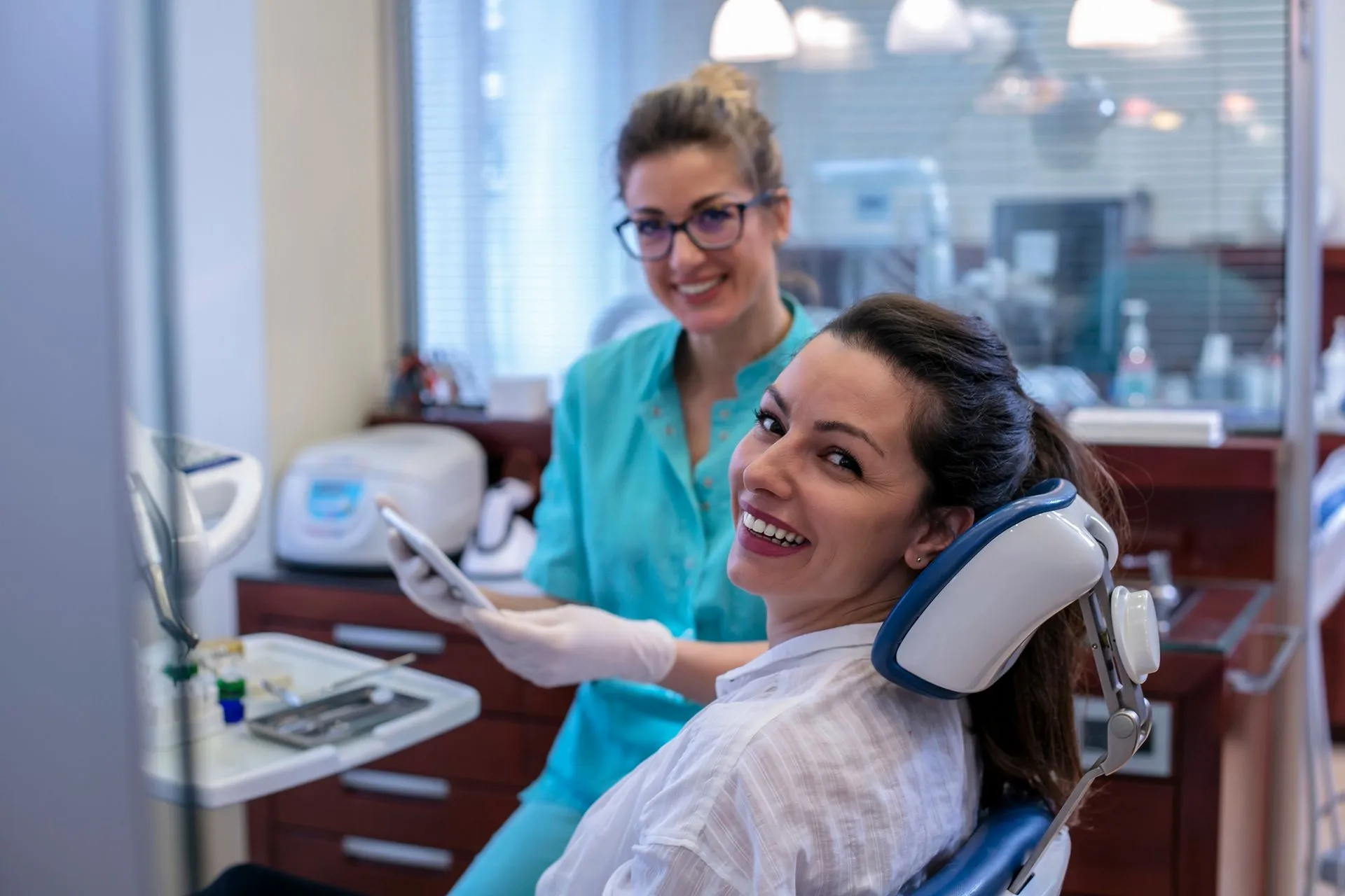 A patient smiling in the dental chair