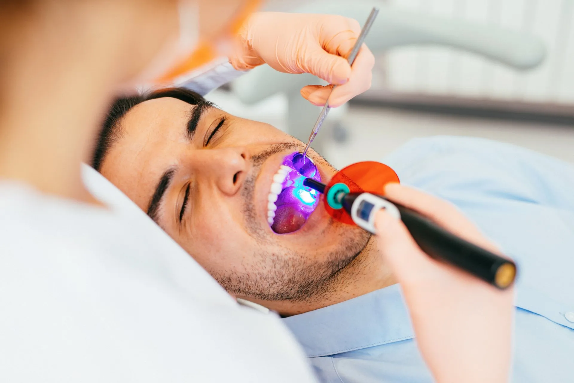 A patient being treated under magnification