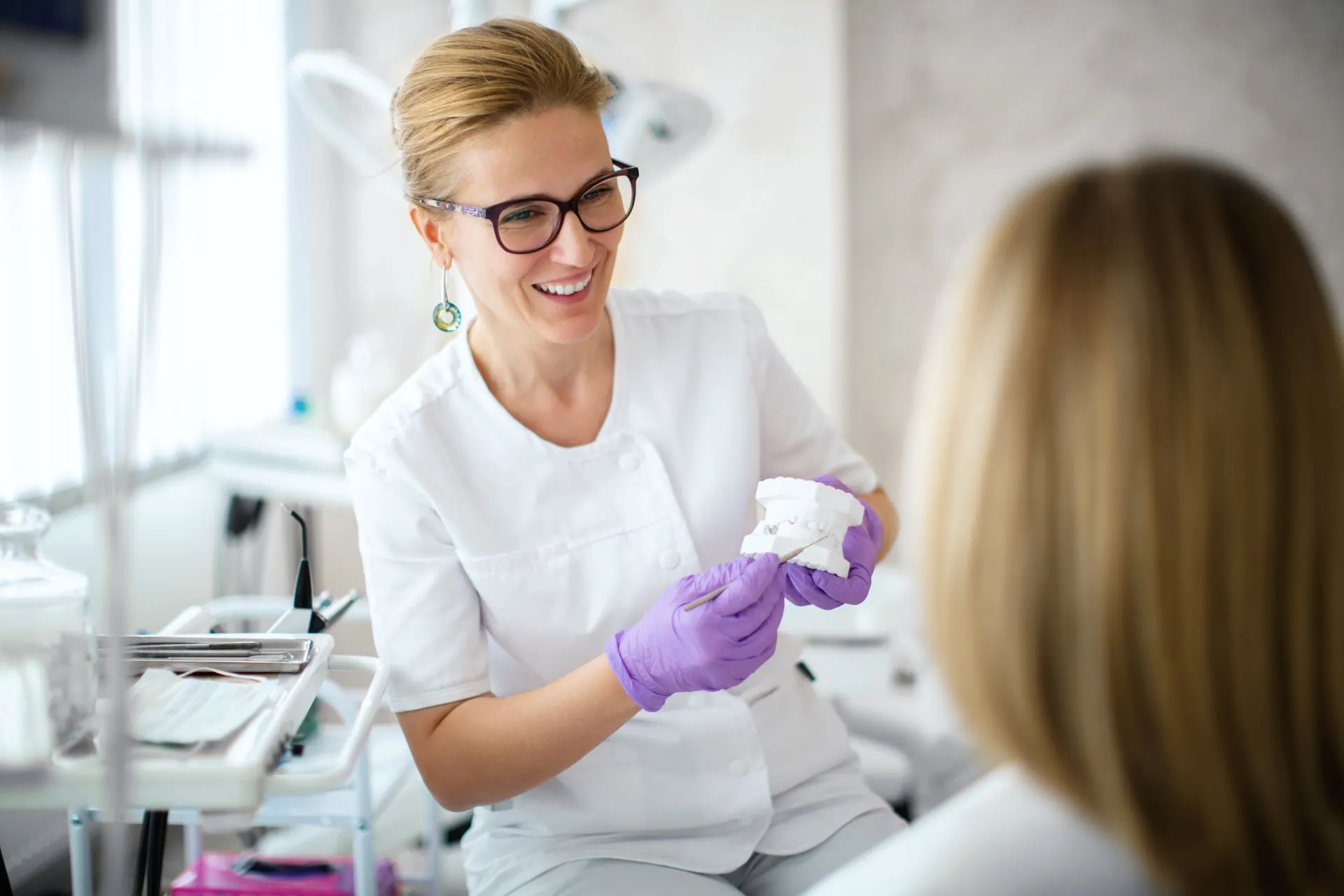 A dentist talking a patient through a treatment plan